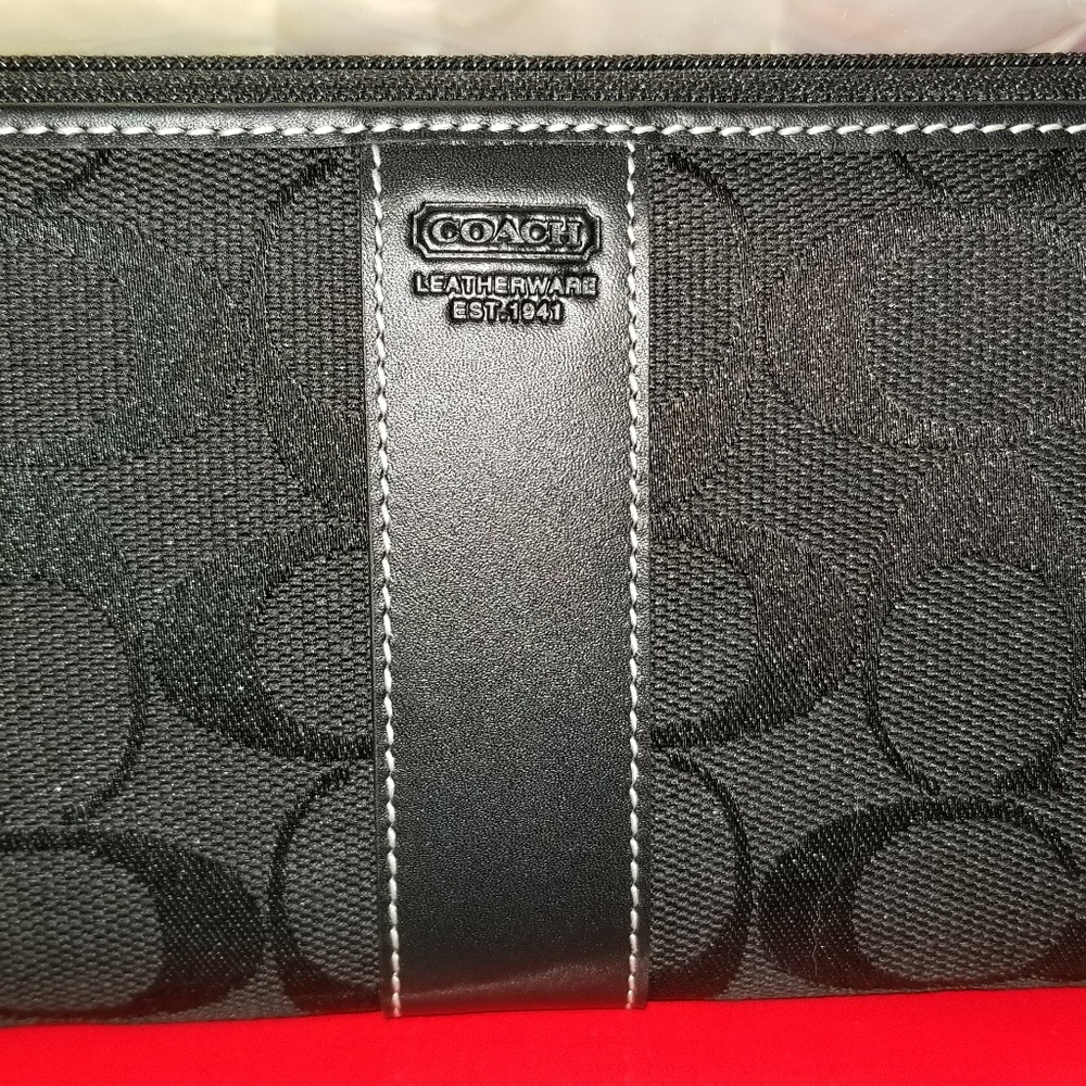 Authentic coach  signature wallet trade value 200.
